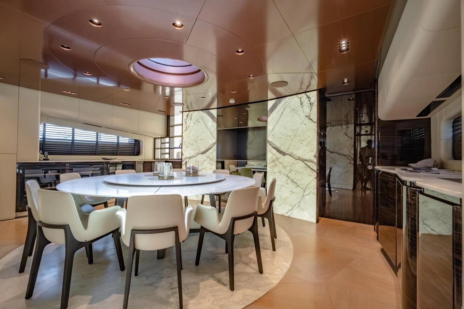 a large kitchen with a table and chairs aboard LA VIE Yacht for Sale