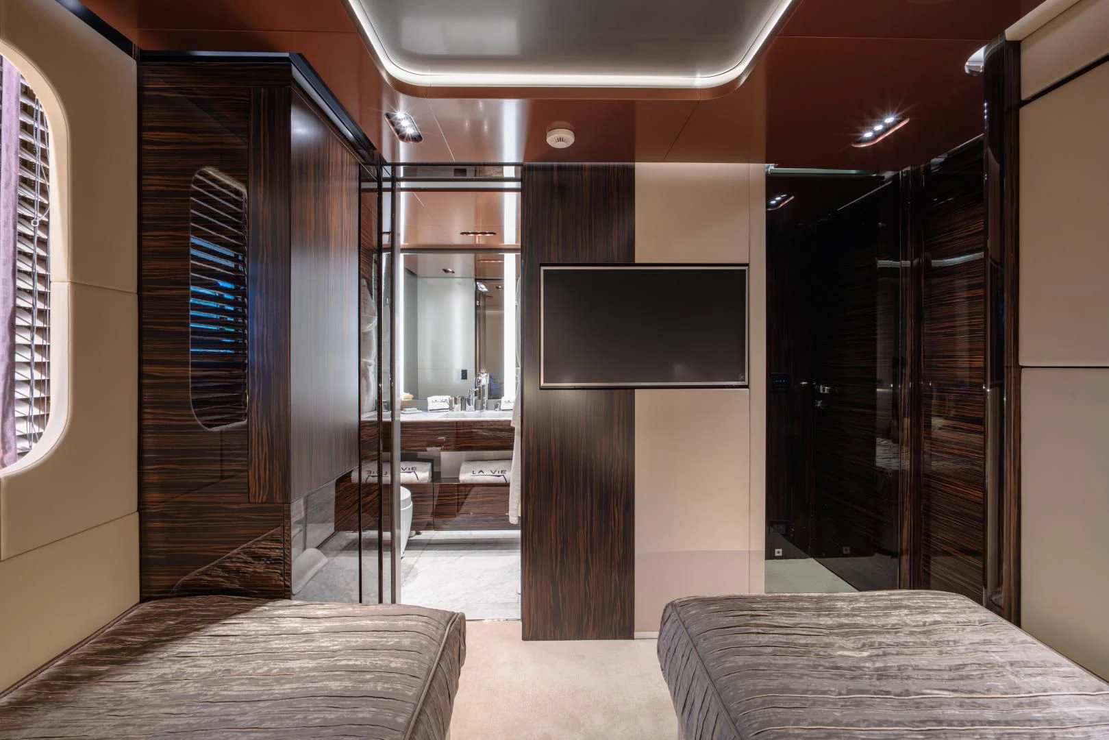 a room with a table and a tv aboard LA VIE Yacht for Sale