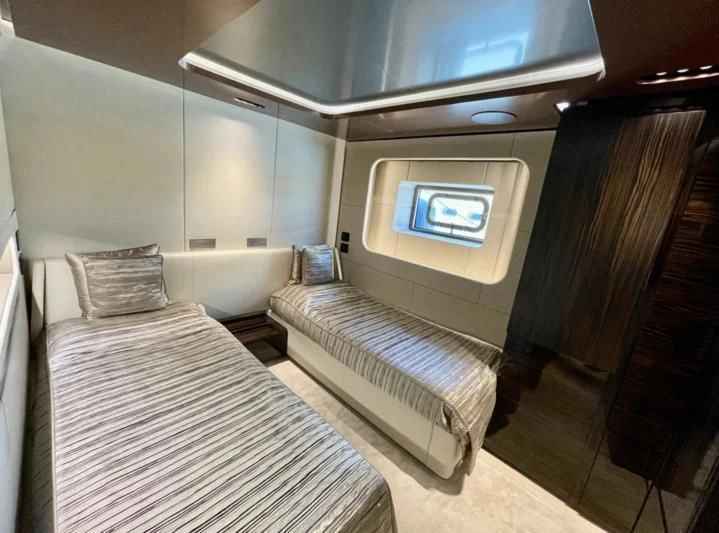 a room with a bed and a mirror aboard LA VIE Yacht for Sale