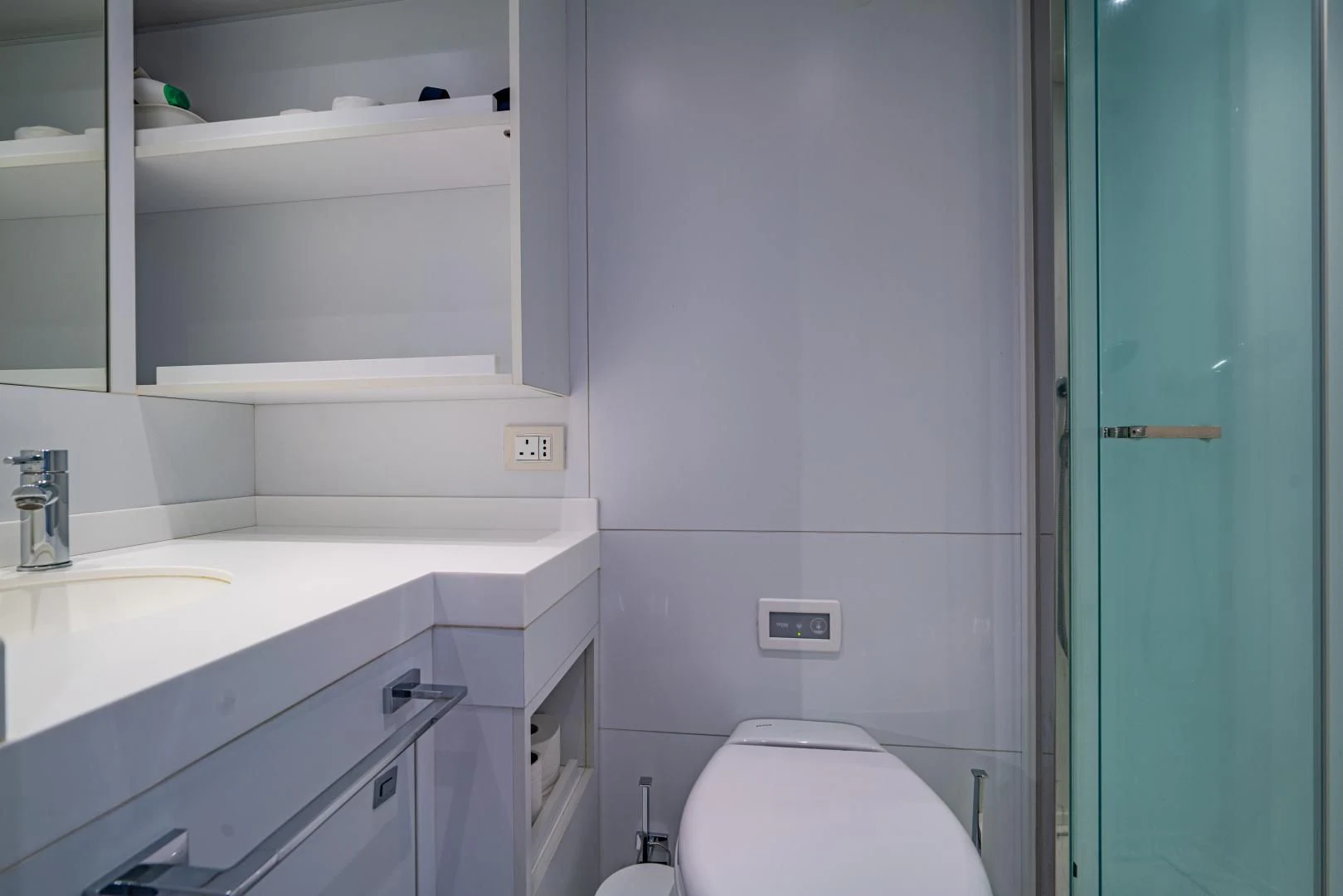 a bathroom with a sink and a toilet aboard LA VIE Yacht for Sale