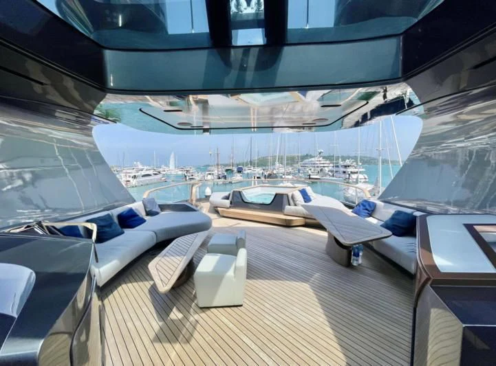 a deck with a view of the water and boats aboard LA VIE Yacht for Sale