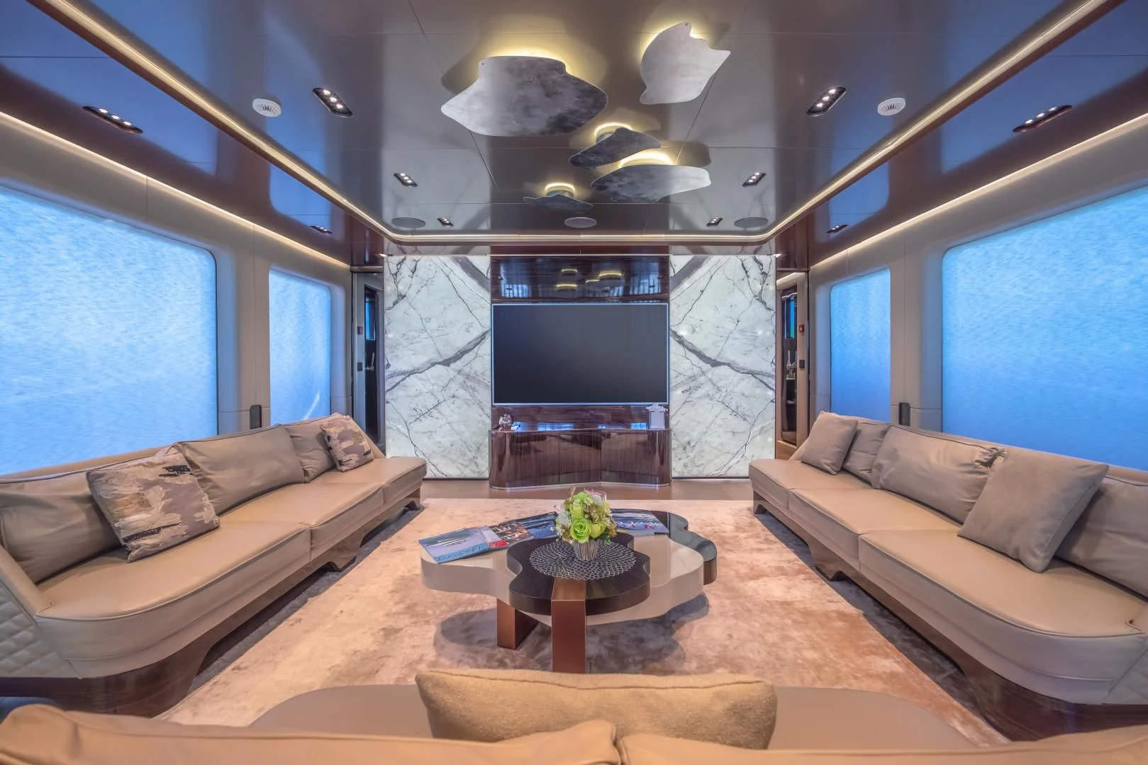 a living room with a couch and a fireplace aboard LA VIE Yacht for Sale
