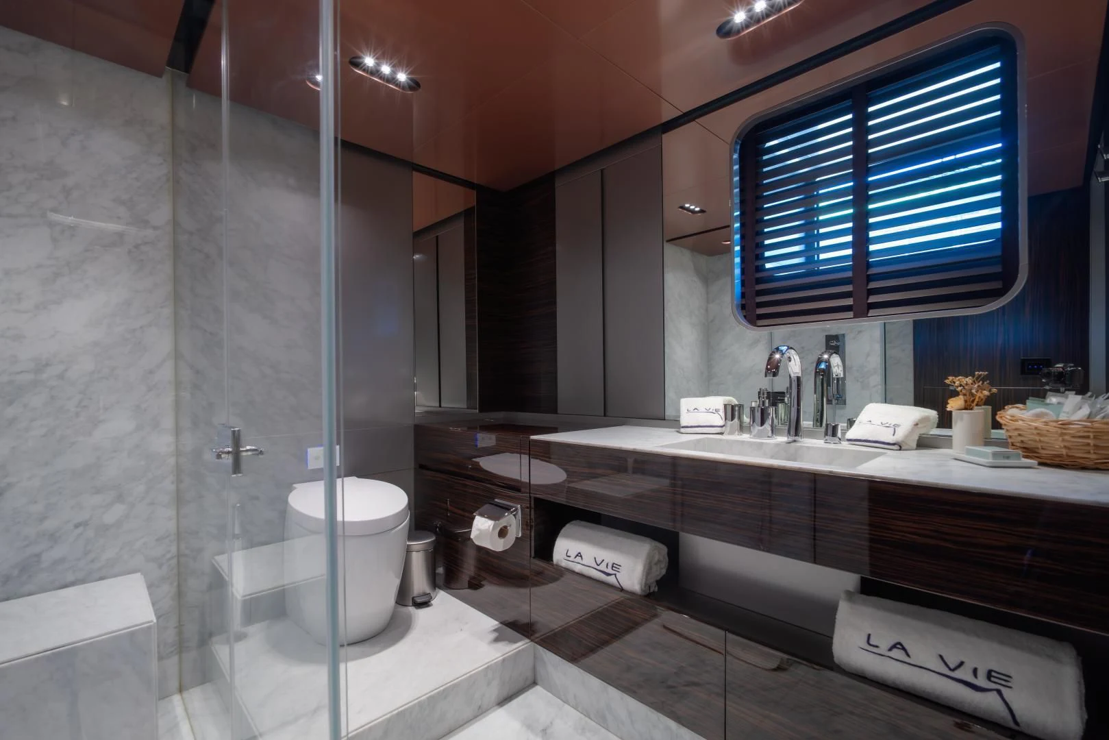 a bathroom with a large mirror aboard LA VIE Yacht for Sale