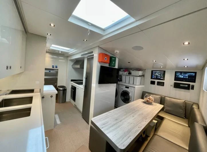 a small living room with a couch and a table aboard LA VIE Yacht for Sale