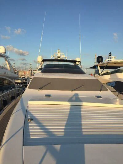 a white yacht in the water aboard AEGINA Yacht for Sale