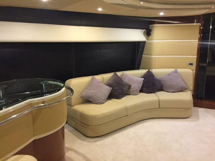 a room with a couch and a bed aboard AEGINA Yacht for Sale
