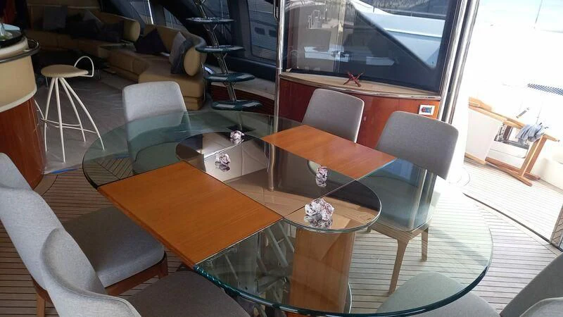 a room with a table and chairs aboard AEGINA Yacht for Sale