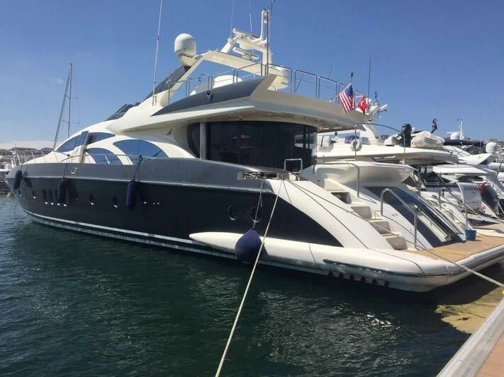 a boat docked at a pier aboard AEGINA Yacht for Sale