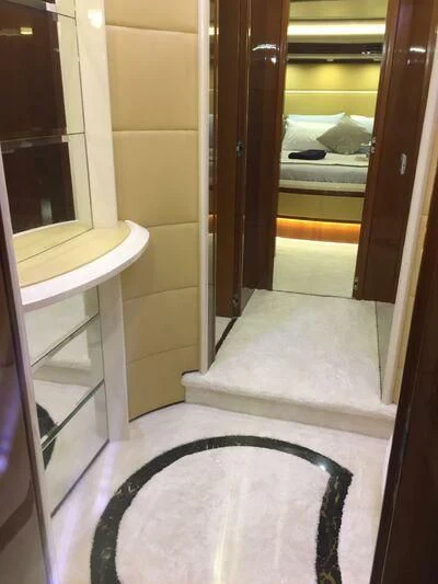 a mirror reflecting a person lying on the ground aboard AEGINA Yacht for Sale