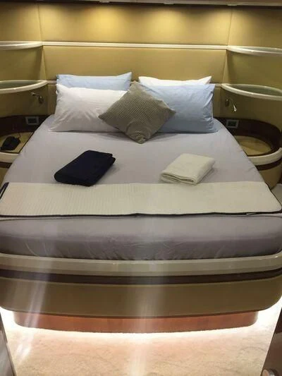 a bed with pillows aboard AEGINA Yacht for Sale