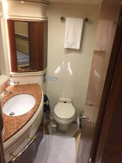 a bathroom with a toilet and sink aboard AEGINA Yacht for Sale