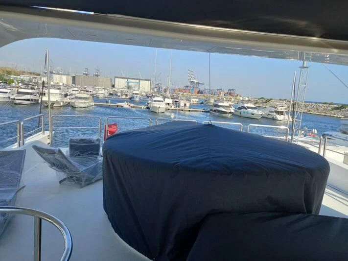 a boat dock with boats aboard AEGINA Yacht for Sale
