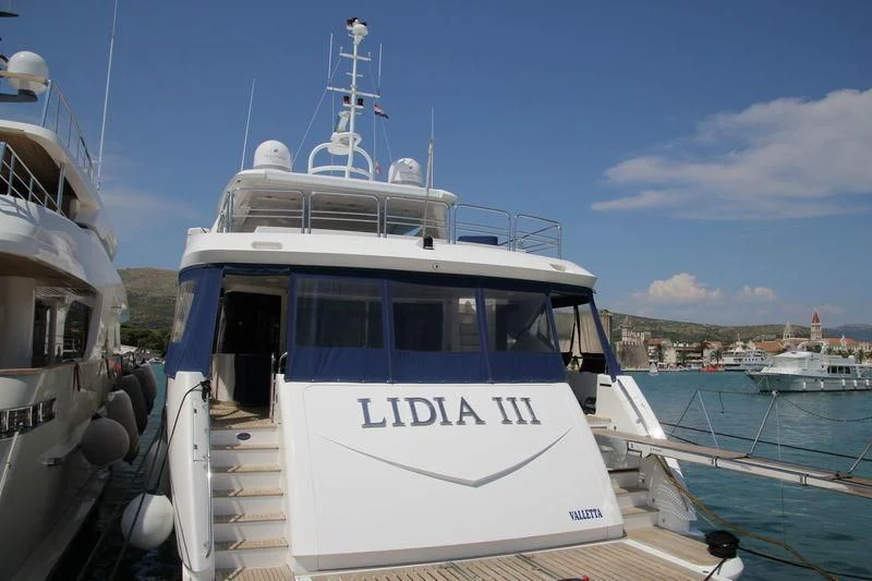 a boat docked at a pier aboard YVONNE Yacht for Sale