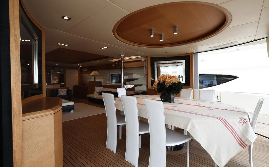 a room with chairs and a table aboard YVONNE Yacht for Sale