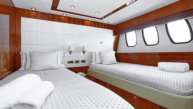 a room with two beds aboard YVONNE Yacht for Sale
