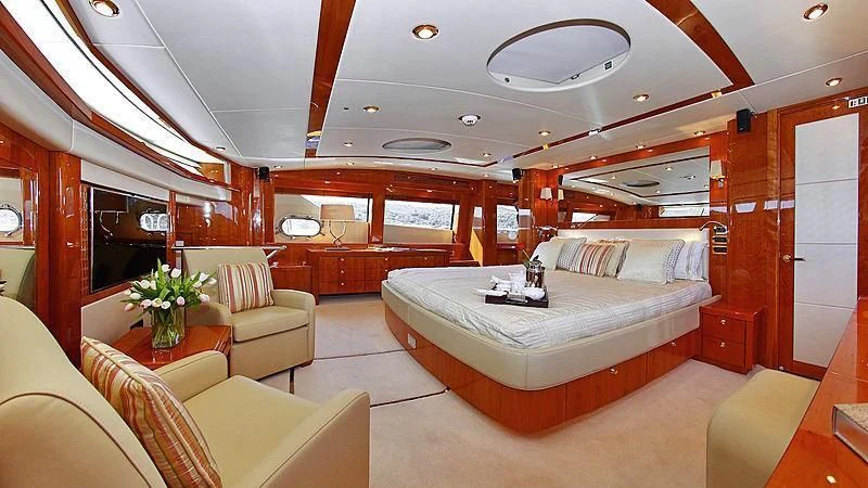 a room with a bed and a couch aboard YVONNE Yacht for Sale