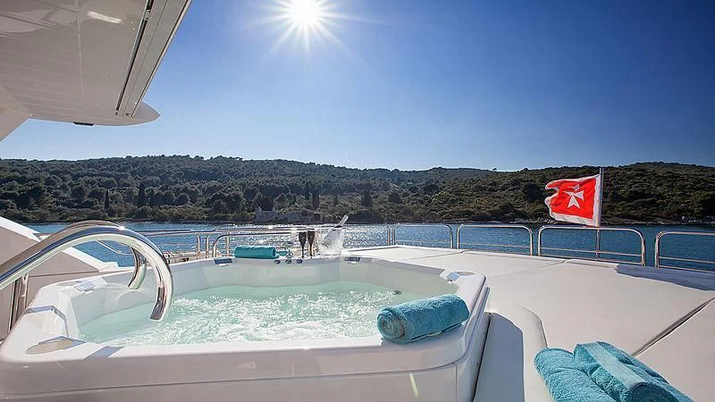 a pool with a flag aboard YVONNE Yacht for Sale
