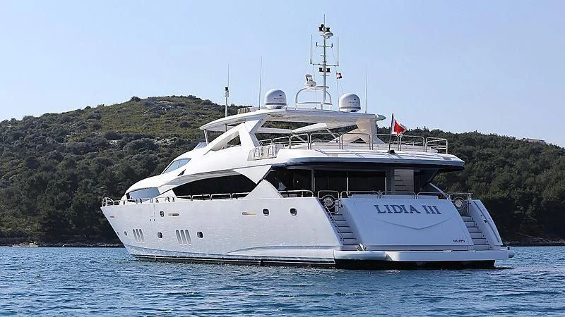 a large white boat on the water aboard YVONNE Yacht for Sale