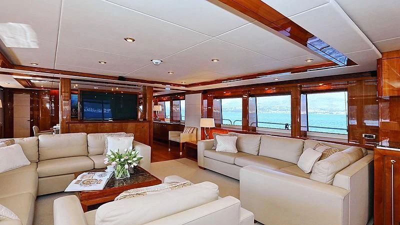 a living room with a couch and a table aboard YVONNE Yacht for Sale
