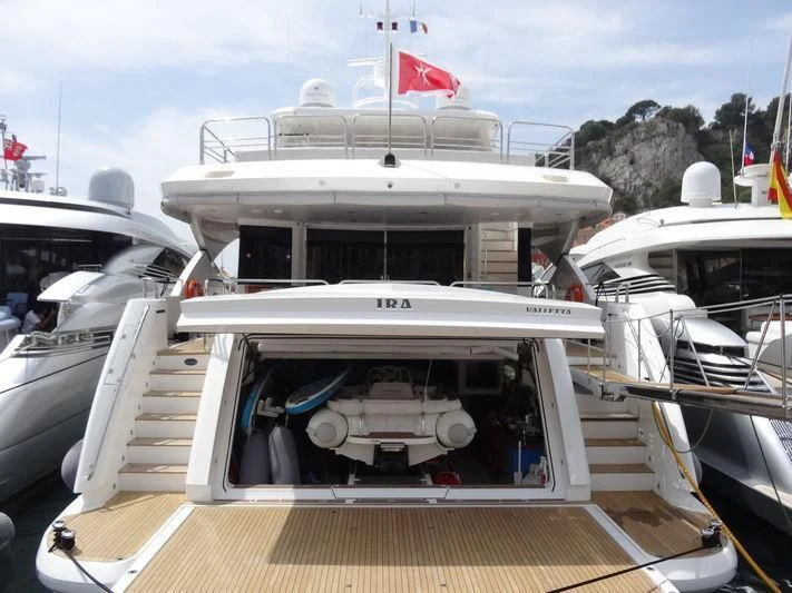 a boat with a flag on the front aboard YVONNE Yacht for Sale