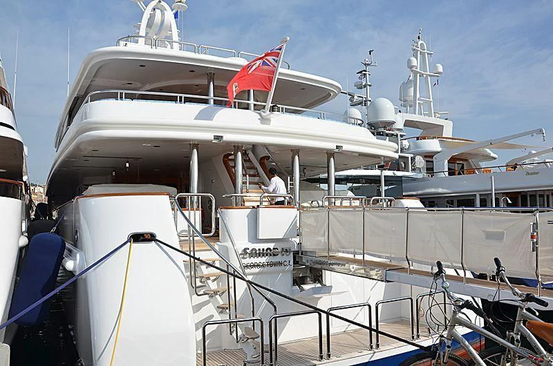 a boat with a red and white flag on the front aboard SAHAB IV Yacht for Sale