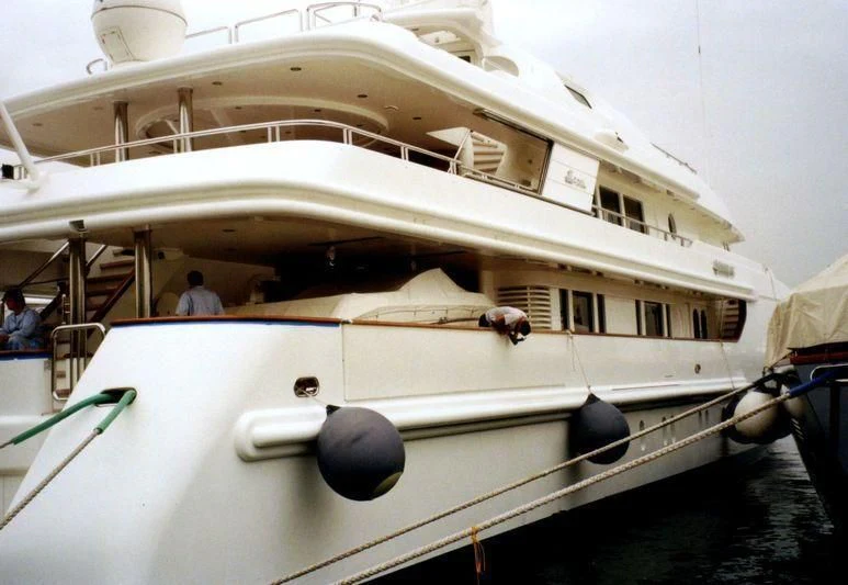a white boat with a black circle on the front aboard SAHAB IV Yacht for Sale