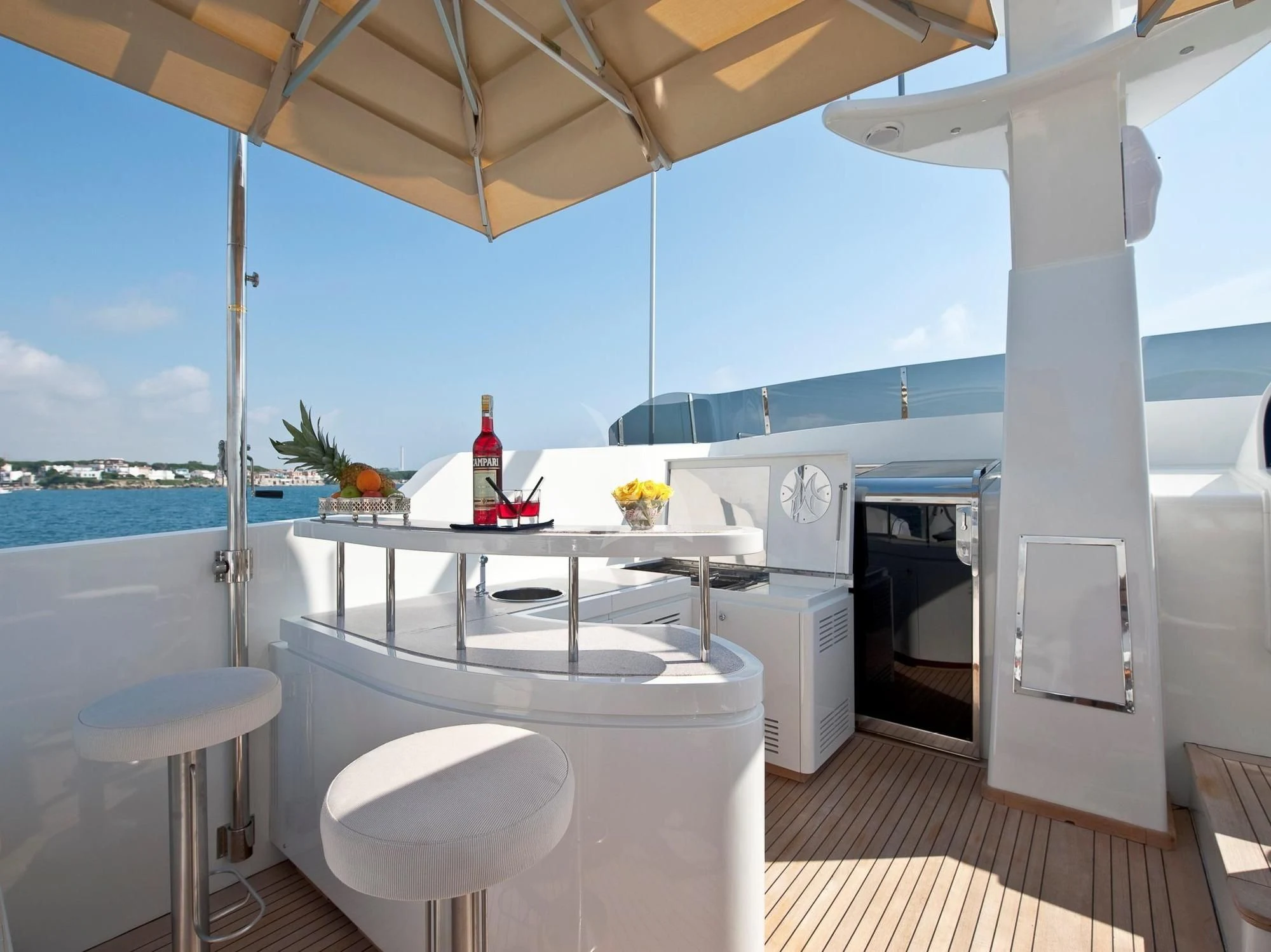 a kitchen with a bar and a bar on the roof aboard MRS. WHITE Yacht for Sale