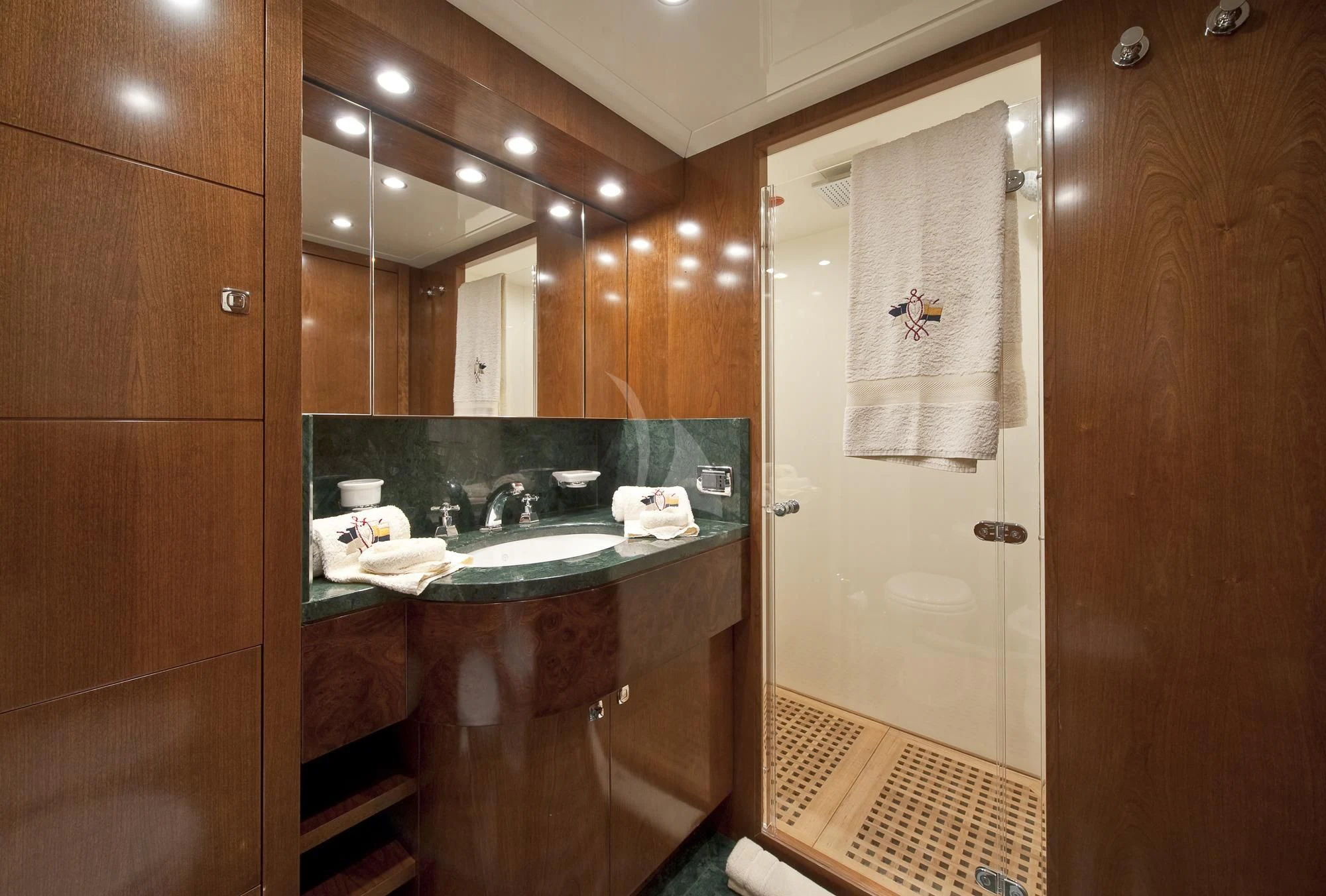 a bathroom with a sink and a mirror aboard MRS. WHITE Yacht for Sale