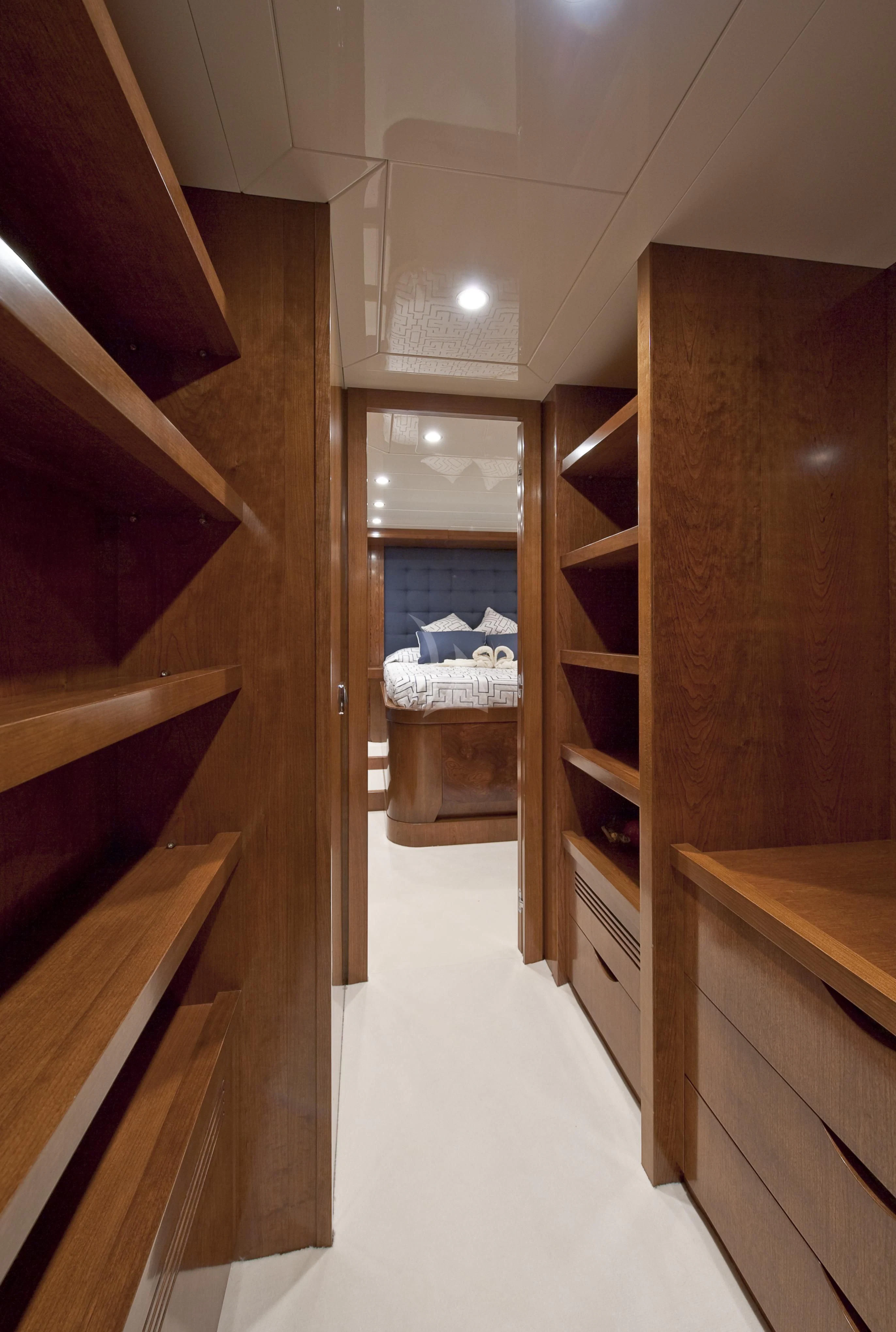 a room with wooden cabinets aboard MRS. WHITE Yacht for Sale