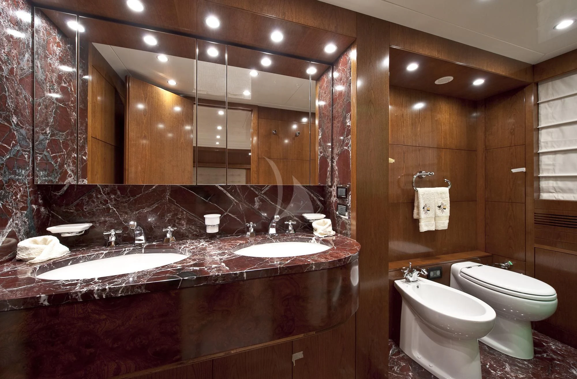a bathroom with a large mirror aboard MRS. WHITE Yacht for Sale