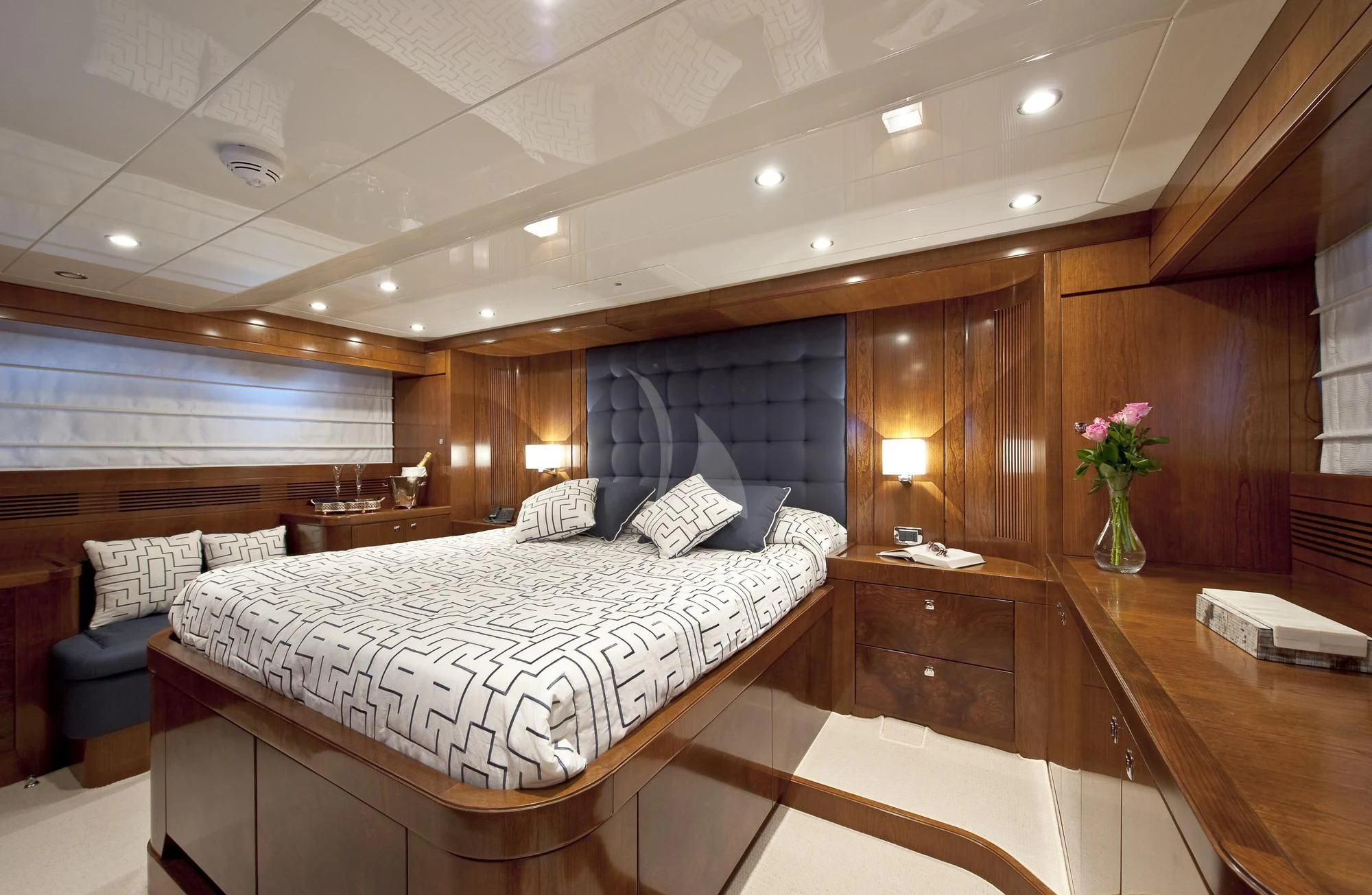 a room with a bed and a desk aboard MRS. WHITE Yacht for Sale