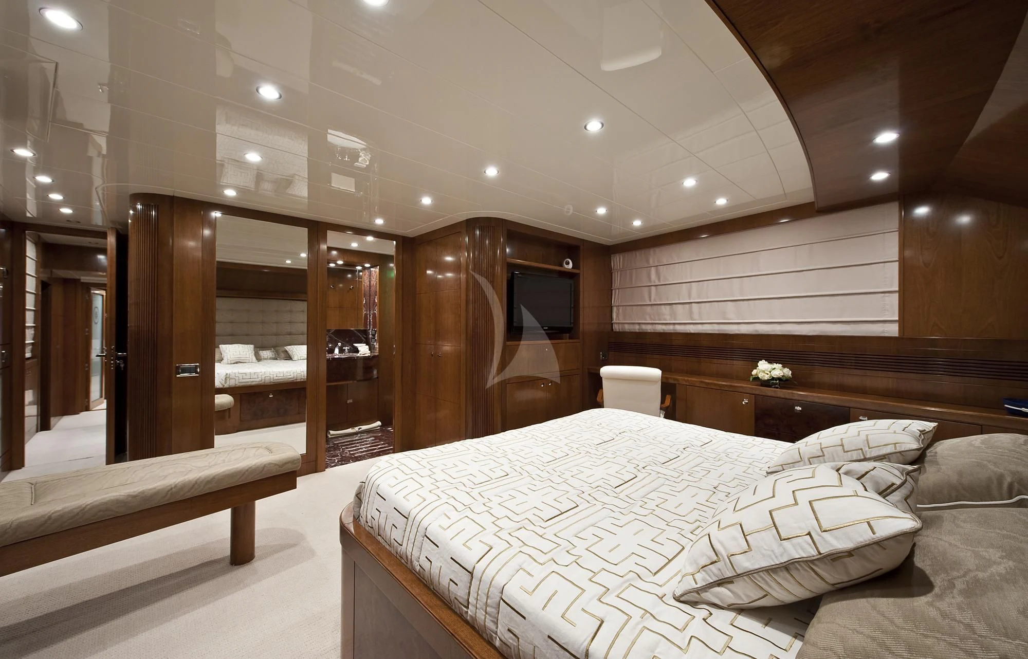 a room with a bed and a mirror aboard MRS. WHITE Yacht for Sale