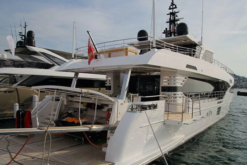 a large white boat on the water aboard GOLD STAR Yacht for Charter
