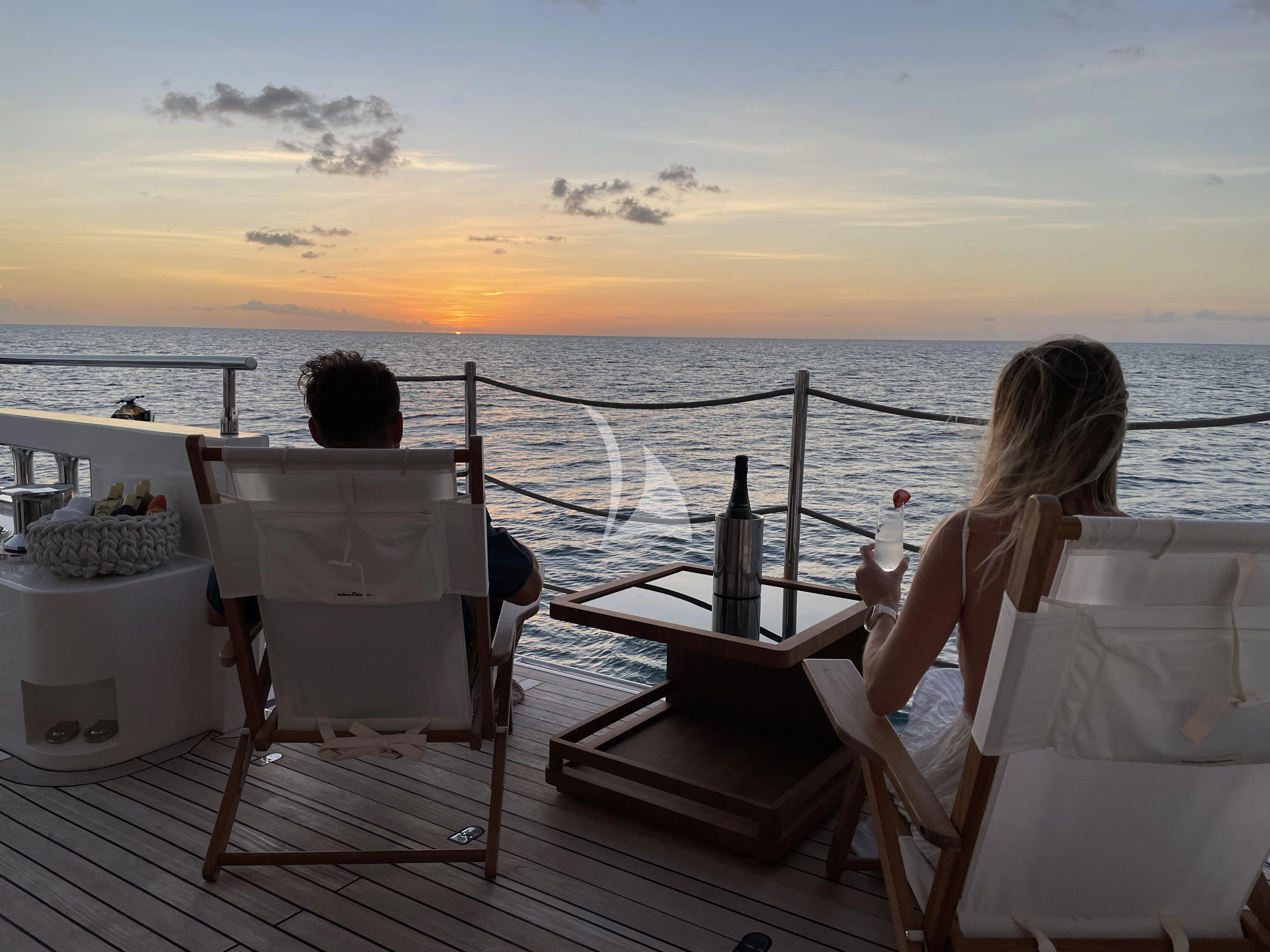 a couple sitting on a boat aboard GOLD STAR Yacht for Charter