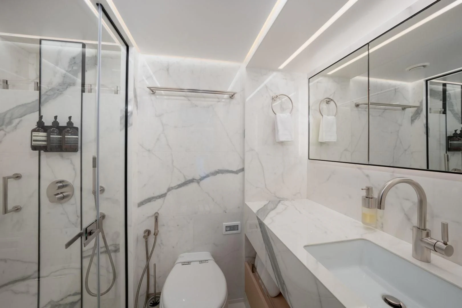 a bathroom with a glass shower aboard GOLD STAR Yacht for Charter