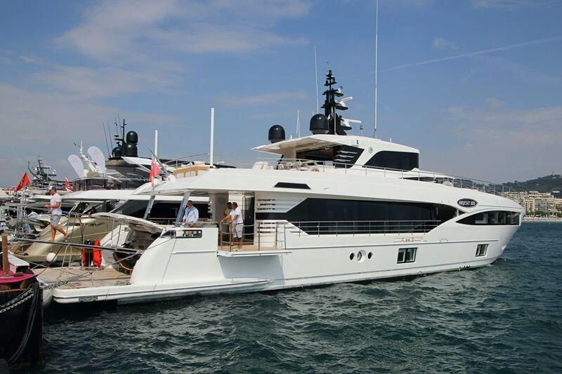 a white boat with people on it aboard GOLD STAR Yacht for Charter