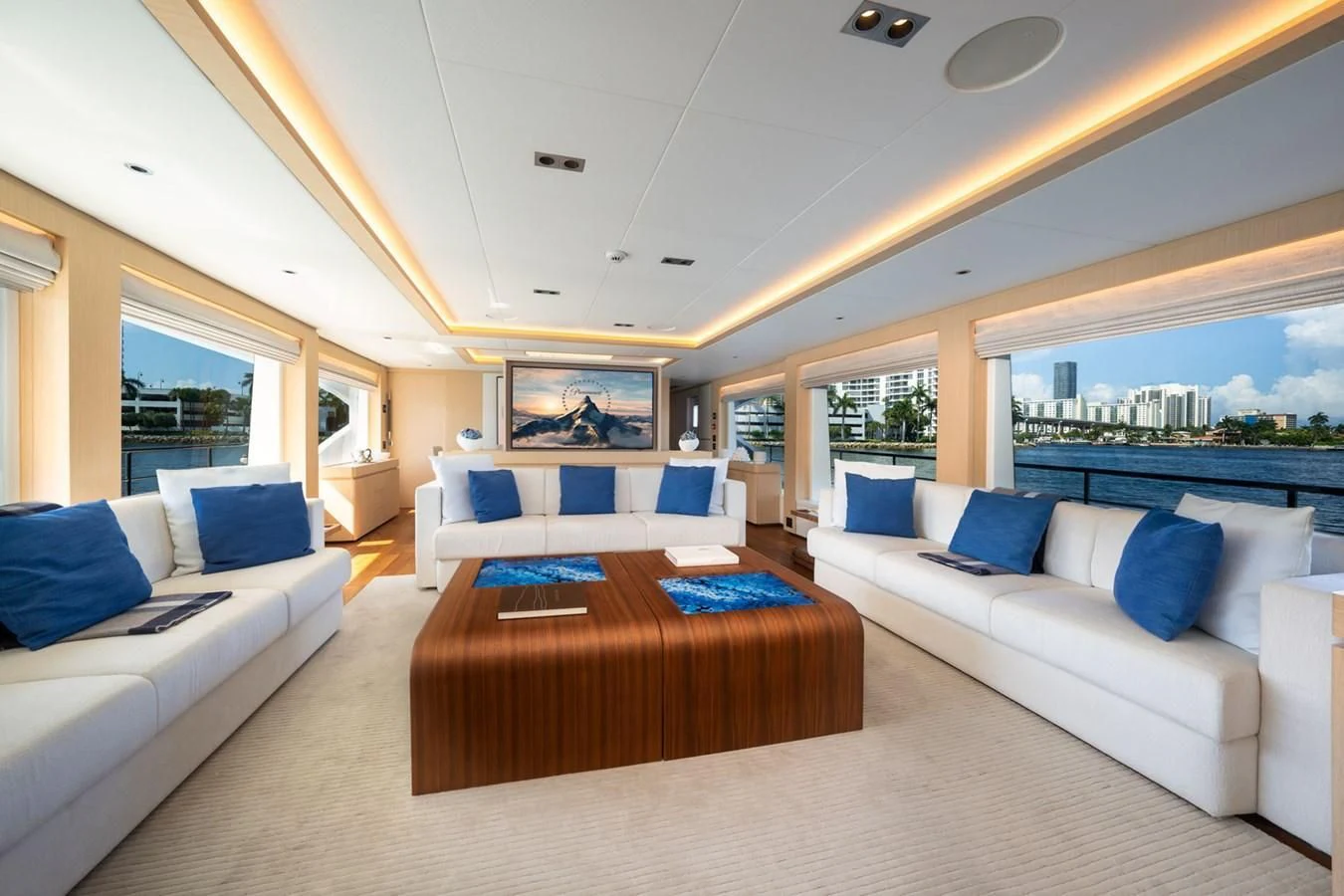a living room with a couch and a table aboard GOLD STAR Yacht for Charter