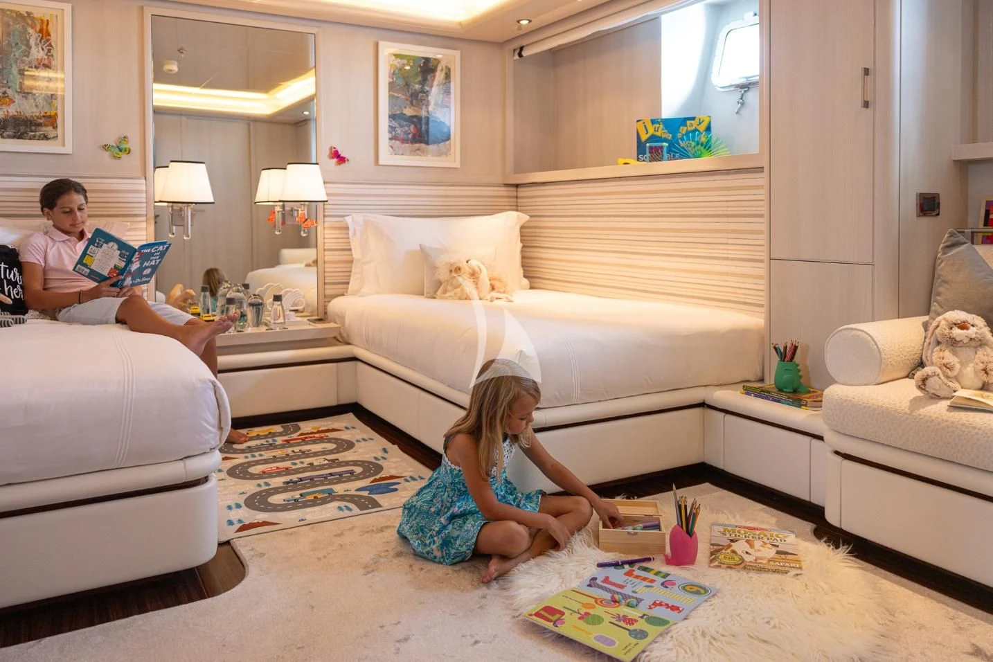 a person sitting on the floor in a living room aboard ETERNITY Yacht for Sale