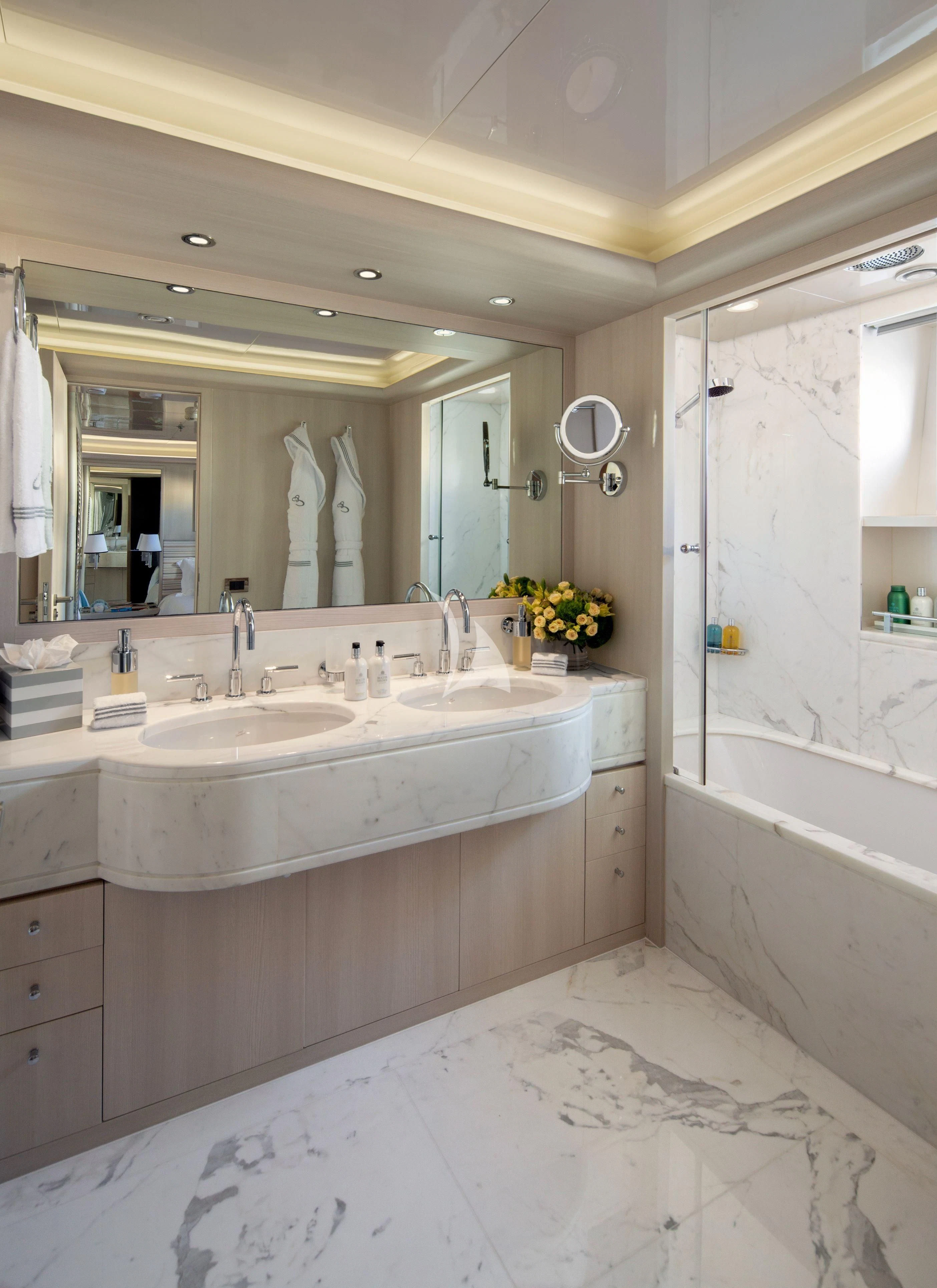a bathroom with a large mirror aboard ETERNITY Yacht for Sale