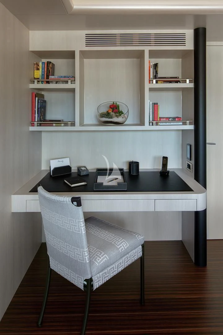 a white office with a black chair aboard ETERNITY Yacht for Sale