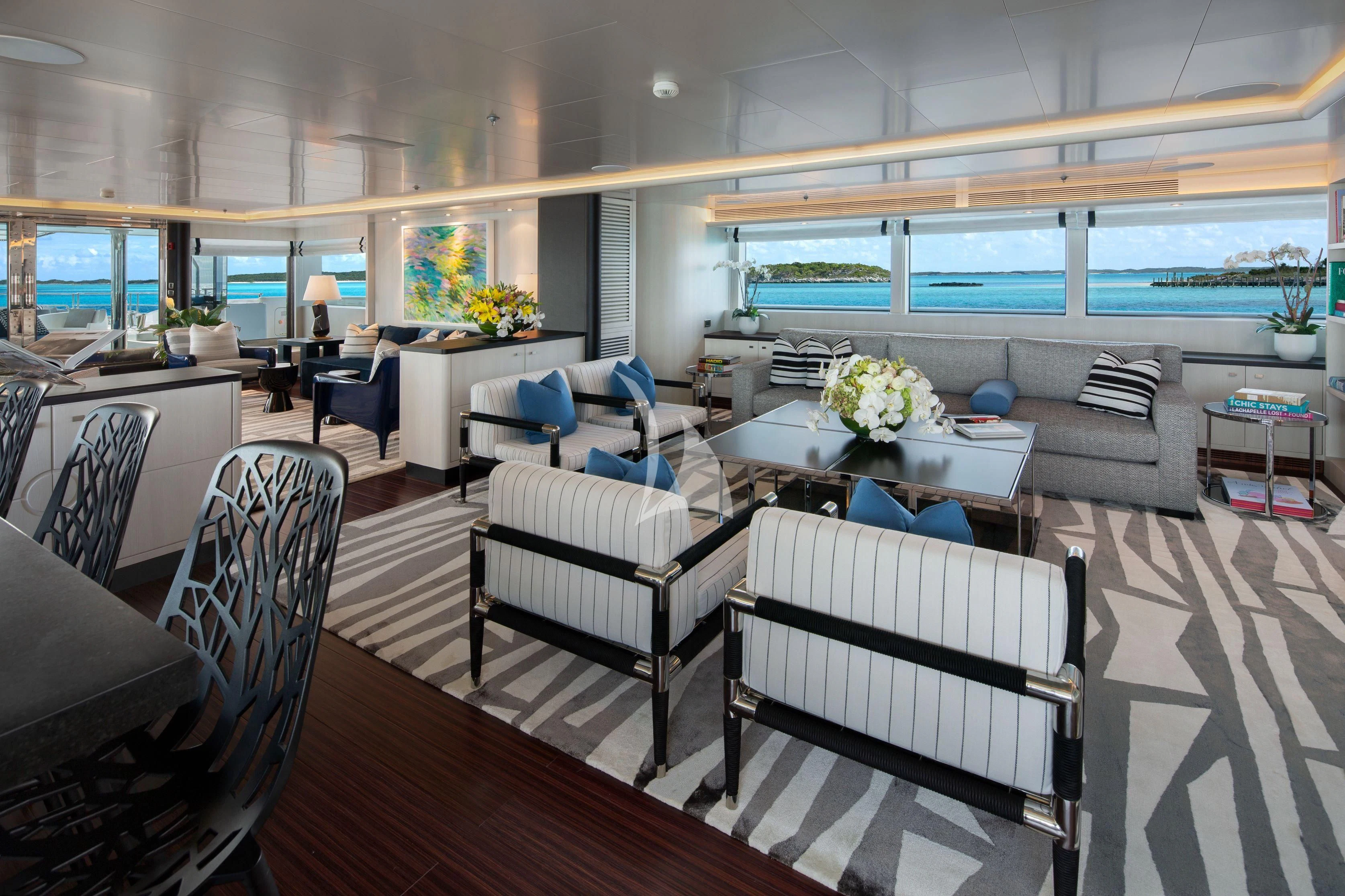a large living room with a large window aboard ETERNITY Yacht for Sale