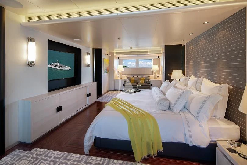 a bedroom with a large bed aboard ETERNITY Yacht for Sale