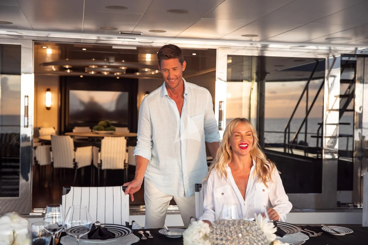 a man and a woman in a restaurant aboard ETERNITY Yacht for Sale