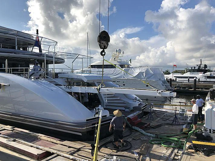 a boat is being loaded with supplies aboard ETERNITY Yacht for Sale