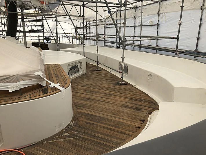a room with a bed and a large white bed aboard ETERNITY Yacht for Sale