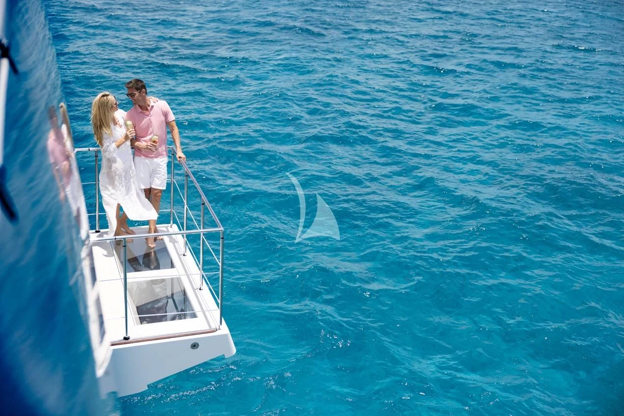 a man and woman on a boat aboard ETERNITY Yacht for Sale