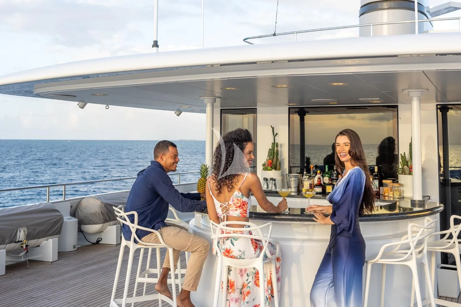 a group of people sitting on a boat aboard ETERNITY Yacht for Sale