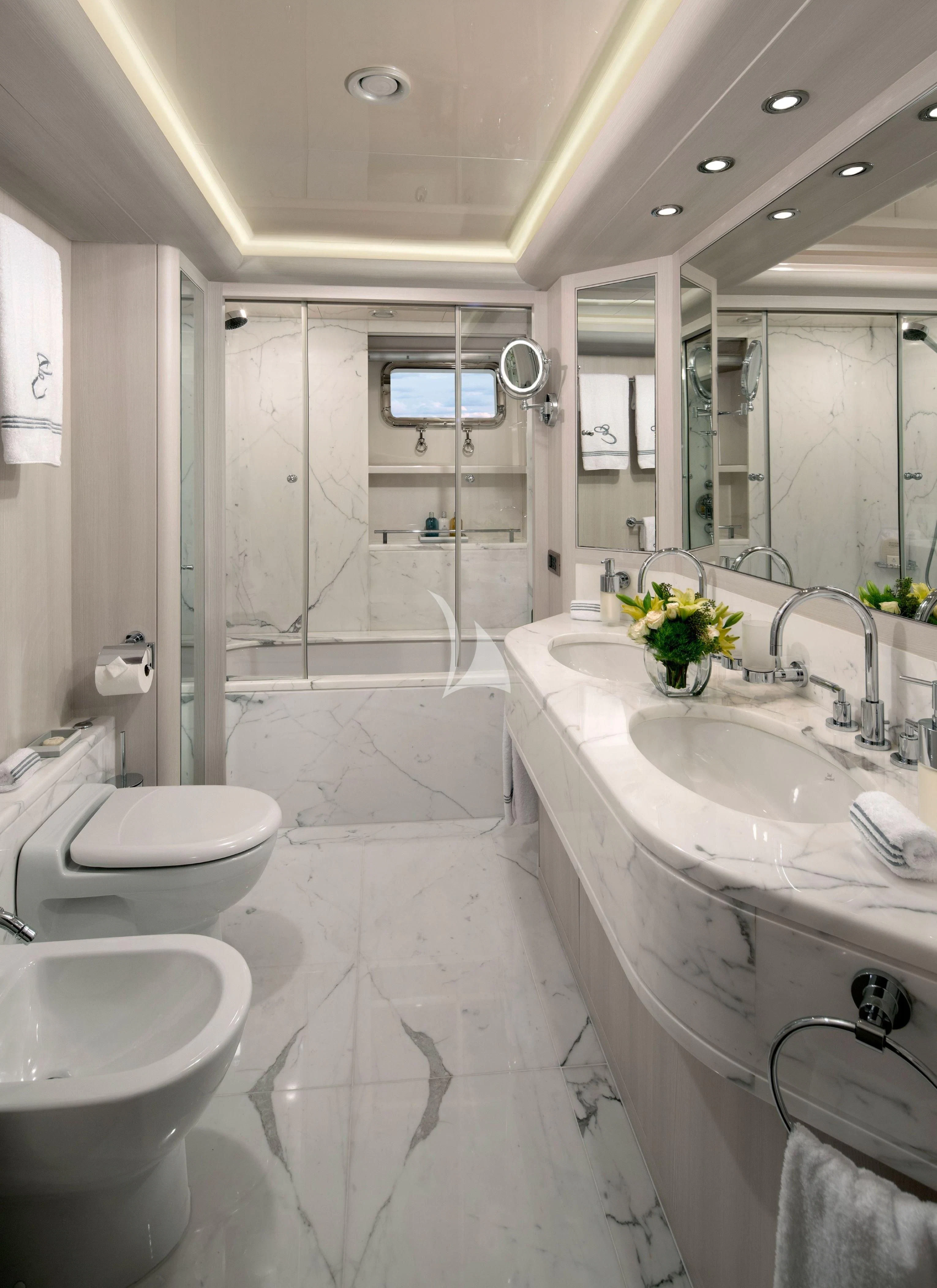 a bathroom with a large mirror aboard ETERNITY Yacht for Sale