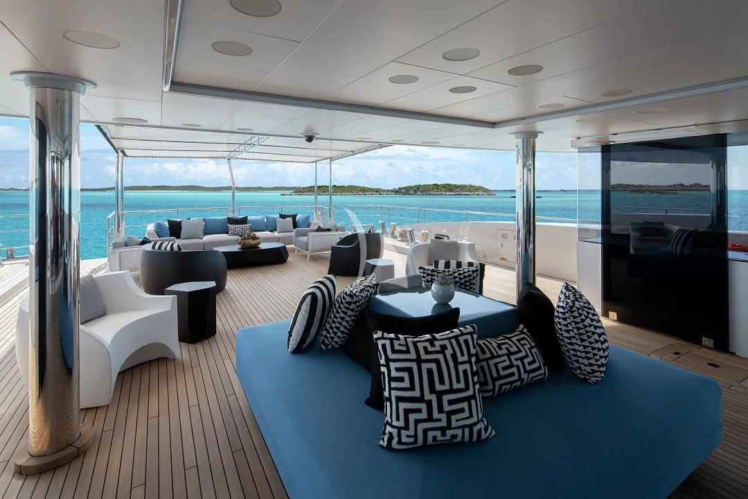 a large living room with a large balcony aboard ETERNITY Yacht for Sale