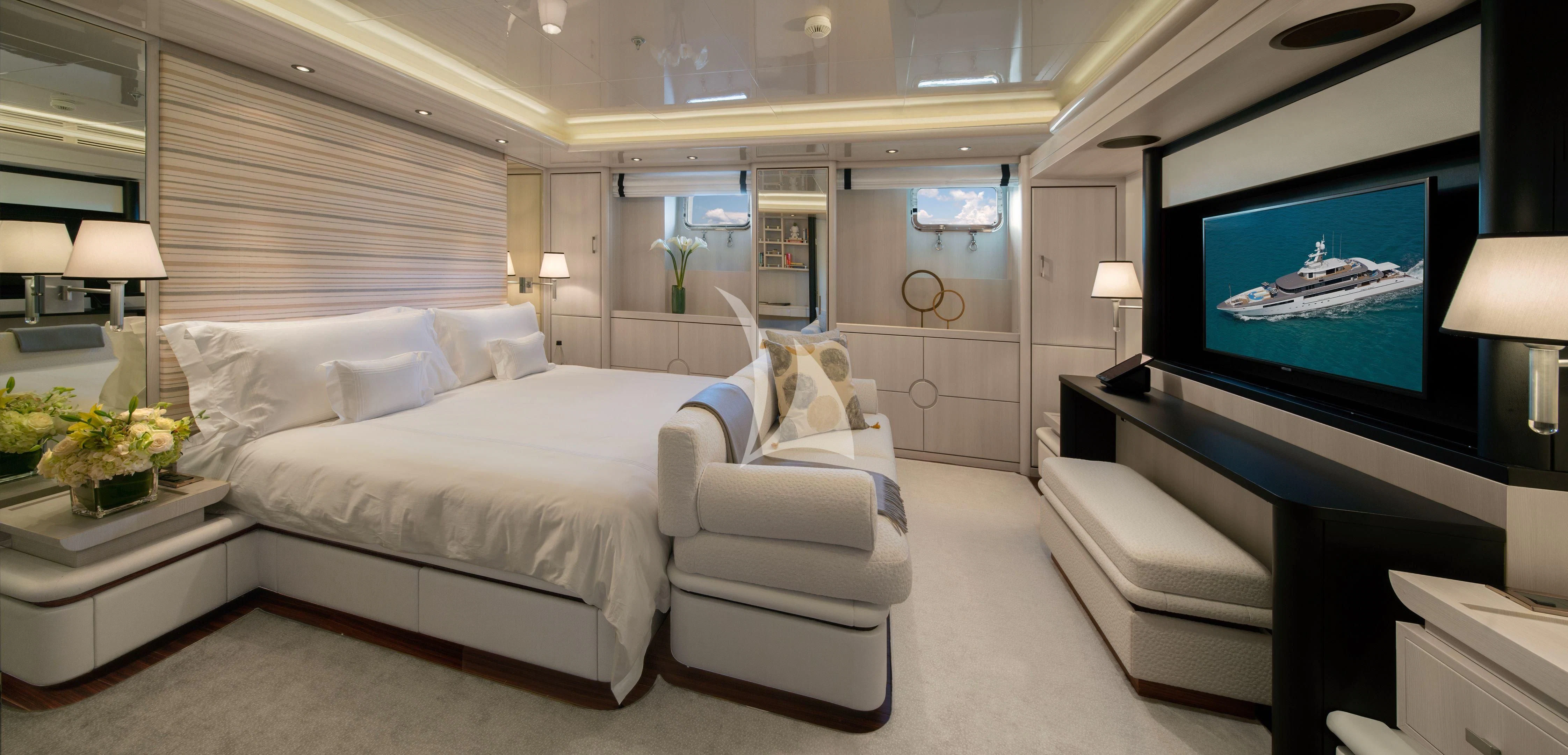 a room with a bed and a television aboard ETERNITY Yacht for Sale